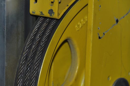 Closeup detail of an elevator�s cable winch with signs of usage