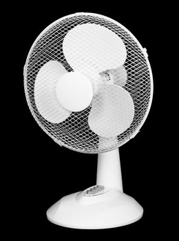 Table plastic electric fan isolated on black background