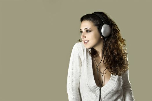 Portrait of a young beautiful sexy woman listening music