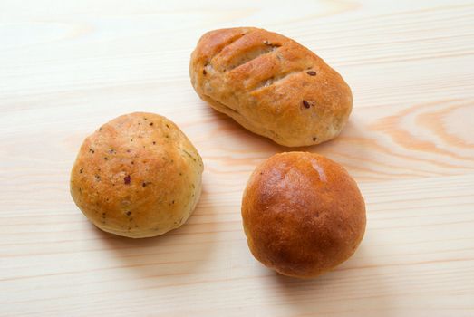 Fresh italian  bread on a rustically wooden plate