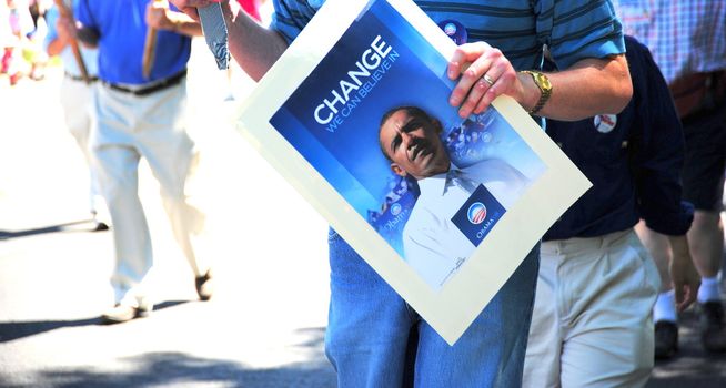 Supporters marching with signs of Barack Obama.