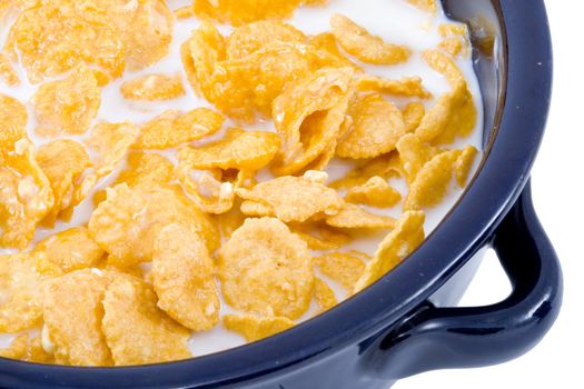 a bowl of cornflakes with milk - healthy diet