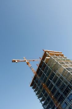 Large building under construction with scaffold