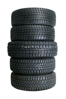 Brand new tires stacked up and isolated on white background