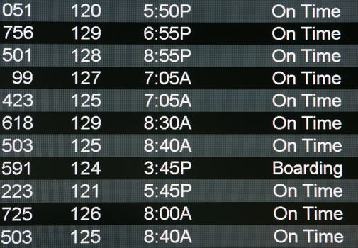 Digital airport board showing arrivals and departures on time