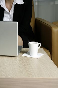 Woman focused on her work using a laptop over a wireless network