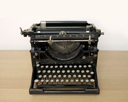 Retro typewriter on a desk - space for text above