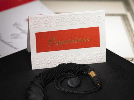 greeting card on the mortar board and diploma