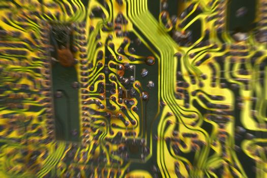 Colorful television/computer circuit board, focus on center with zoom blur, lit from behind