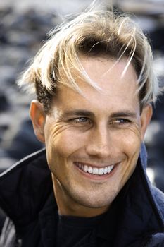 Portrait of blond Caucasian mid-adult male smiling.
