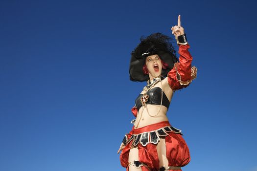 Young adult Caucasian female dressed in pirate costume.