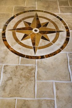 Marble floor with star shape in affluent home.