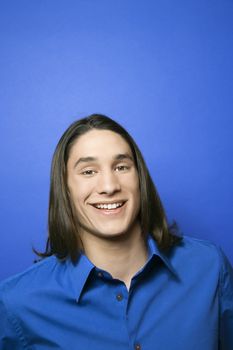 Portrait of Asian-American teen boy smiling.