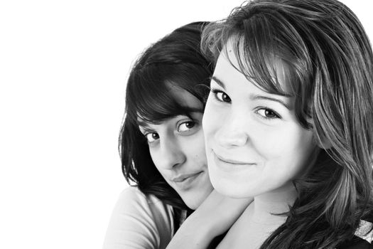 Two girls portrait with copy space, over white background.