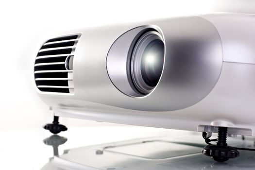 Video projector. High key shot on studio. White background.