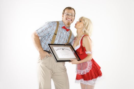 Young Caucasian man receiving kiss and certificate from young woman.
