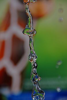water drop in green background
