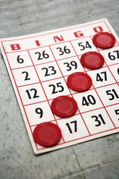 Red bingo card with winning chips.