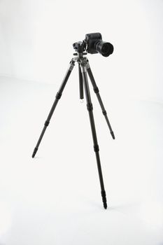 Studio shot of camera and tripod.