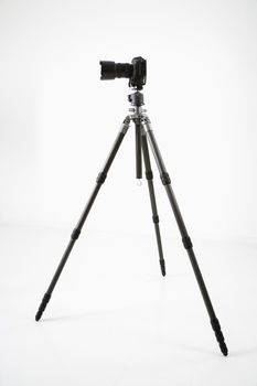 Studio shot of camera and tripod.