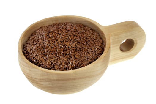 brown flx seeds on a rustic wooden scoop (cup), isolated on white