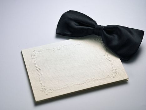 bow tie on top of the blank card