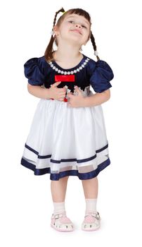 Little beautiful smiling girl in a dress on a white background