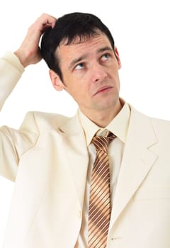 Puzzled man scratches his head, isolated on a white background