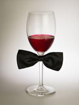 red wine glass with bow tie