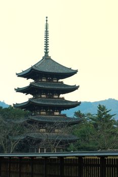 scenic view on traditional five storey wooden pagoda in Kofuku-ji temple, Nara, Japan at early twilight time