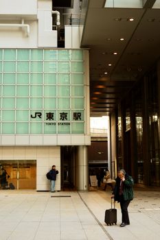 Tokyo station north entrance with walking people 