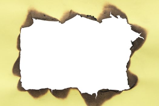 Frame made from yellow burned paper. Isolated with clipping path for your images of text