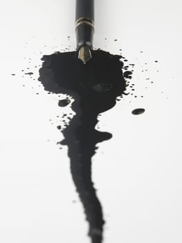 Inkblots and pen on the plain background