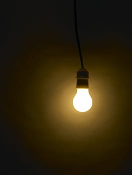 bulb illuminating in the dark