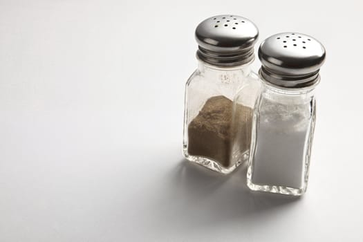 Salt and Pepper Shakers on the plain background