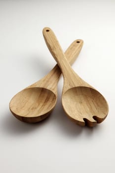 wooden fork and spoon on the plain background