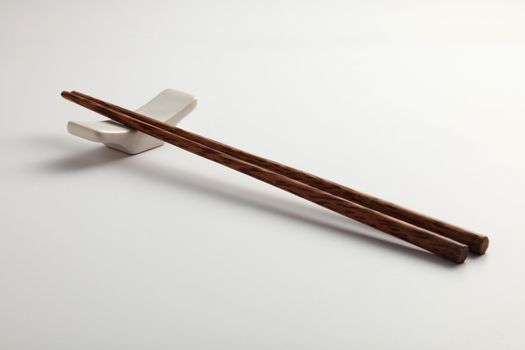 side view of chopstick on the plain background