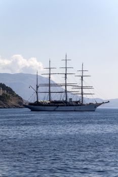 A lone pirate ship out on the blue seas