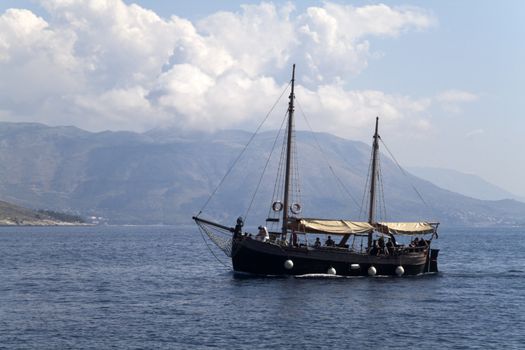 A old small ship out on the blue seas