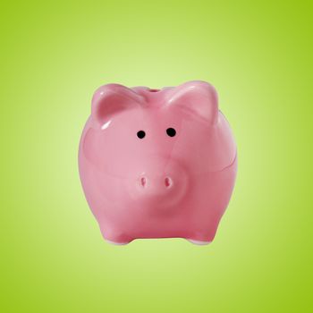 Traditional piggybank isolated on green with clipping path