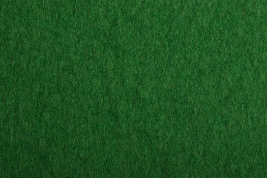 Close-up of a green poker table felt surface