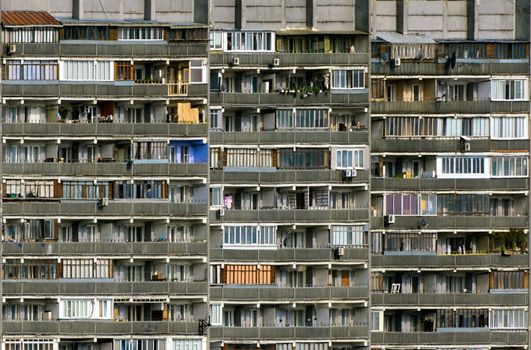 an amazing divercity of windows and balconies on a residential building