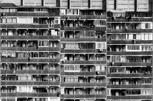 an amazing divercity of windows and balconies on a residential building