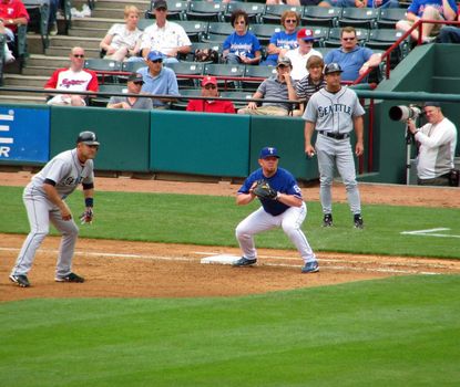 The first baseman for the Texas Rangers holds a runner for the Seattle Mariners on base during a game in May, 2008 in Ranger Stadium in Arlington, Texas.
