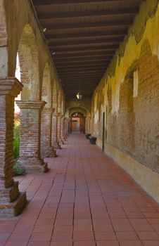 MISSION SAN JUAN CAPISTRANO ARCHES IN HALLWAY