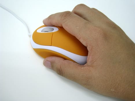 a hand holding a Optical mouse, isolated on white