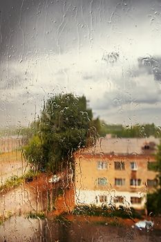 Summer. Weather and spoil a thunderstorm started. Heavy rain outside the window.