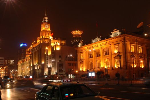 China, Shanghai - Zhongshan Lu by night. City center with famous buildings.