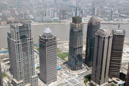 Shanghai - city center with Huangpu river. Modern skyscrapers, still underconstruction.