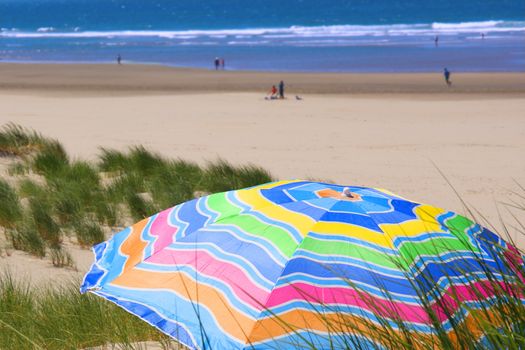 Bright, colorful umbrella on the beach